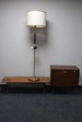 A mid 20th century teak record cabinet together with a teak copper and brass standard lamp and a