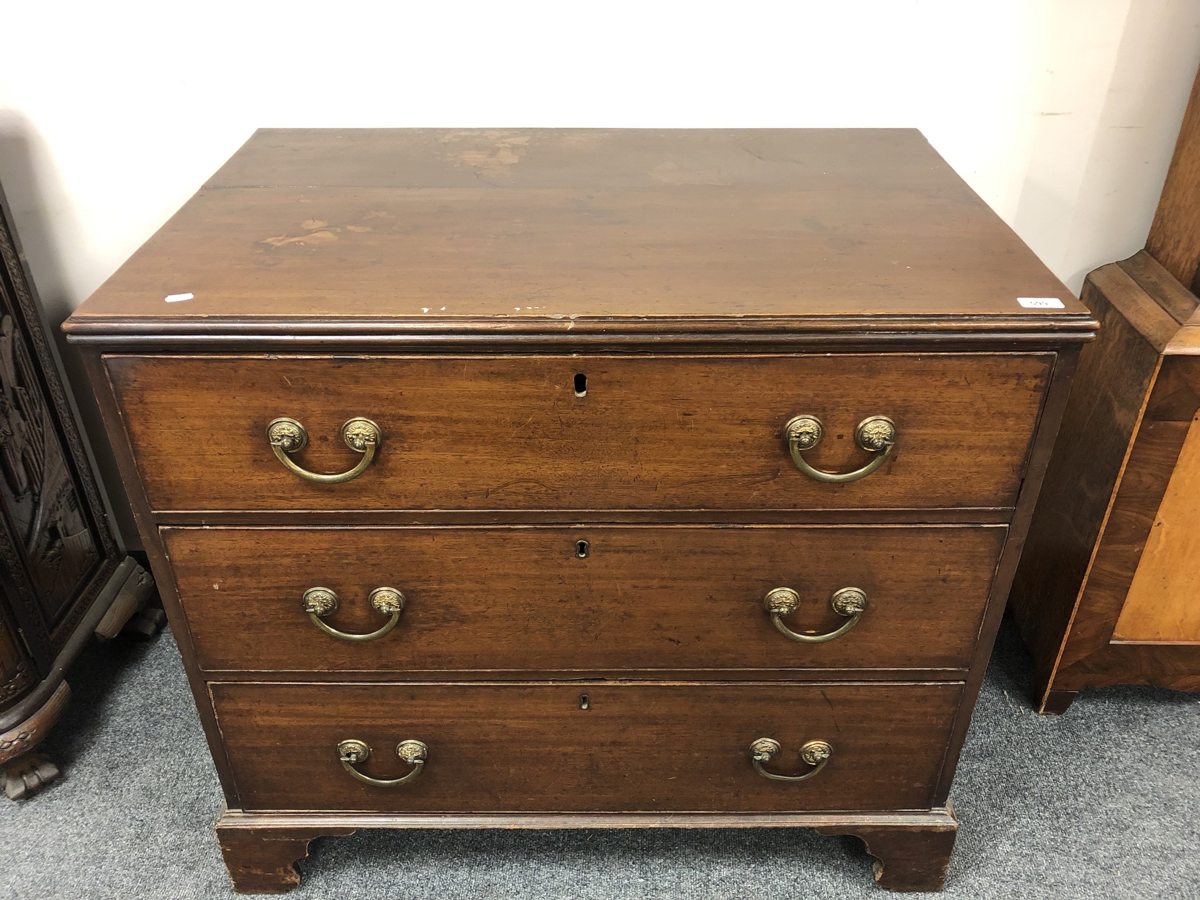 A George III mahogany three drawer chest on bracket feet, width 95 cm.