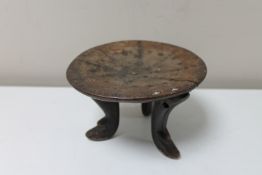 A 20th century African headrest, 16 cm diameter.