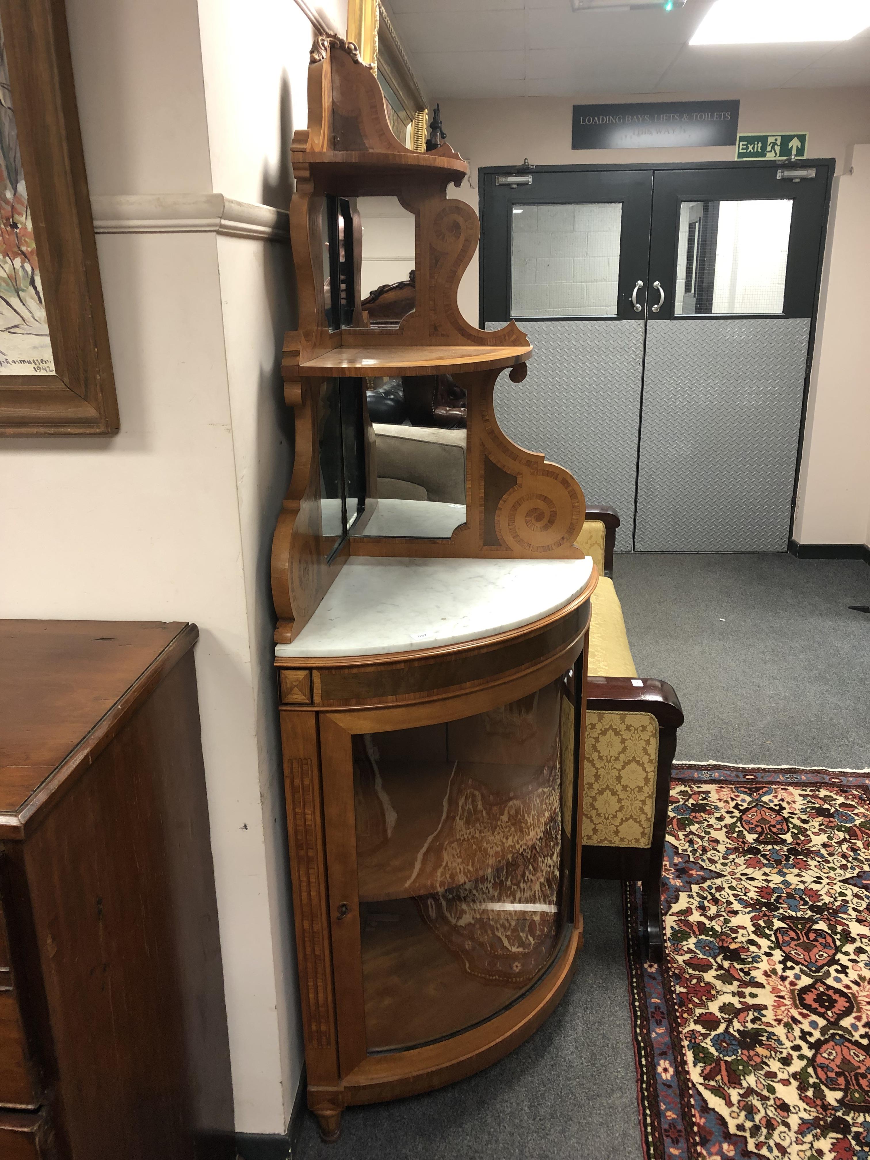 An inlaid satinwood bow fronted cabinet,