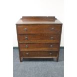 A 1930's oak four drawer chest