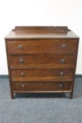 A 1930's oak four drawer chest