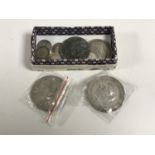 A collection of silver coins to include two 1935 crowns,