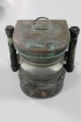 An antique copper ship's master head lamp