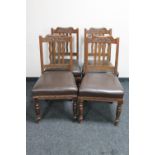 A set of four Arts and Crafts oak dining chairs