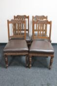 A set of four Arts and Crafts oak dining chairs