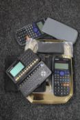 An Olympus dictaphone together with two Casio calculators, Packard Bell personal organiser etc.