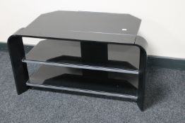 A contemporary glass three tier tv stand