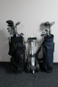 Two golf bags containing Howson irons and assorted drivers,