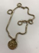 A 9ct gold necklace and circular pendant, 13.7g.