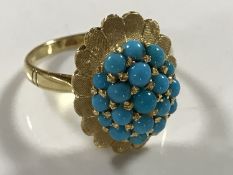 A yellow gold turquoise set ring, indistinctly marked, 5.4g, size N/O.