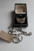 A boxed silver napkin ring, silver bracelet and chain,