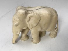 An antique carved ivory elephant,