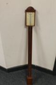 A continental mahogany stick barometer