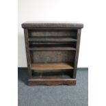 A set of antique carved oak open bookshelves