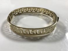 A continental yellow gold bangle, indistinctly marked, 15.3g.