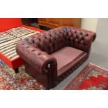 Two seater red leather Chesterfield settee (no cushions)