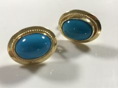 A pair of continental yellow metal turquoise earrings.