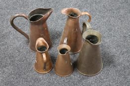 Five antique copper jugs