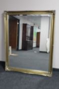 A gilt framed Victorian style overmantel mirror