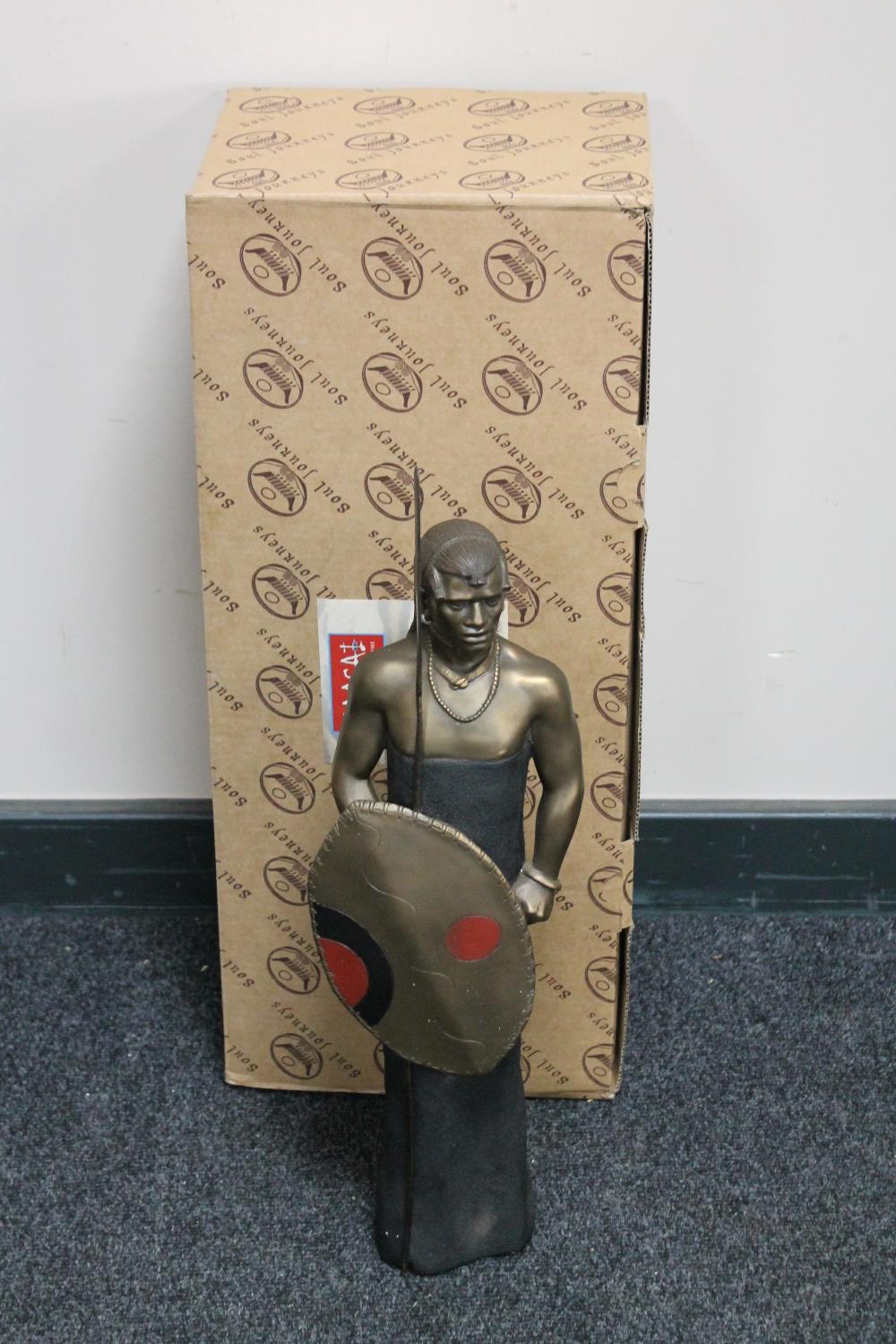 A boxed Tribes the journey home massai figure warrior with shield and spear