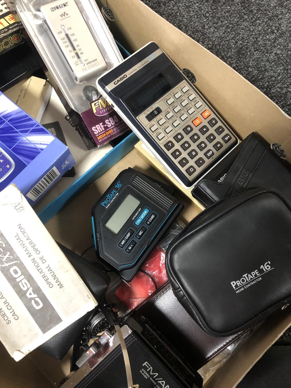 A box of Sony Walkman, Sony FM radio, Casio digital diary, calculators, - Image 5 of 6