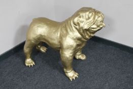 A large gold coloured figure of a bull dog