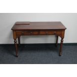 A Victorian mahogany two drawer writing desk