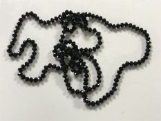 A Victorian French jet long guard chain