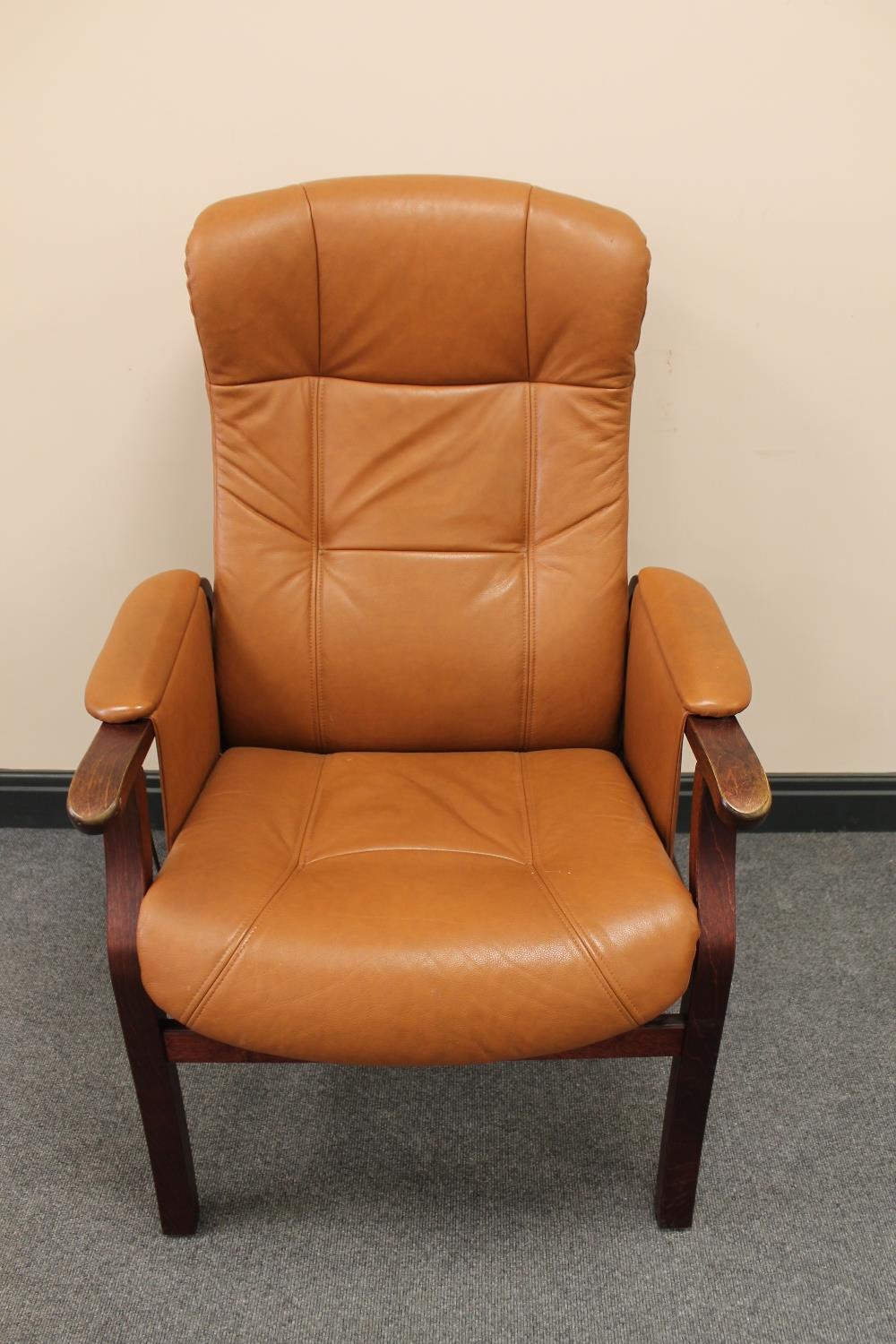 A late twentieth century brown leather beech framed reclining armchair