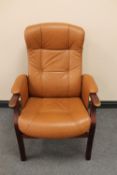 A late twentieth century brown leather beech framed reclining armchair