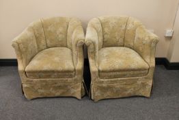 A pair of mid twentieth century tub chairs upholstered in floral fabric