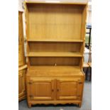 A blond oak dresser