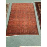 An Eastern rug on red ground,