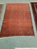 An Eastern rug on red ground,