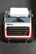 An Aro Erica typewriter in leather case