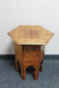 A Middle Eastern inlaid folding occasional table