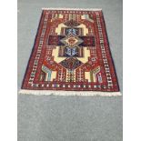 A Ghochan rug of geometric design,