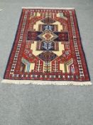A Ghochan rug of geometric design,