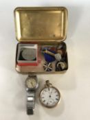 A 1914 Christmas tin containing a small quantity of coins, a gents West Clox wrist watch,