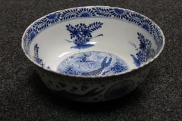 A 19th century Chinese blue and white bowl depicting fish, character marks to base, width 25.5 cm.