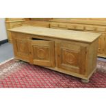 A blond oak triple door sideboard