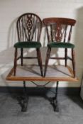 A pub table on cast iron base and two pub chairs