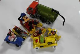 A box of Dinky road sweeper together with seven die cast vehicles including Mini Mouse, Popeye,
