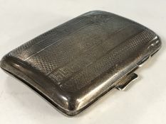 A silver cigarette case,