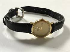 A Raymond Weil 18ct gold plated lady's wristwatch