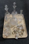 A tray of five antique glass decanters together with a collection of stoppers and two further