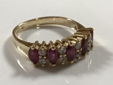 A 14ct gold five stone diamond and ruby ring, 2.9g, size K.