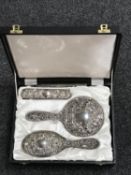 A silver mounted four piece dressing table set, boxed.