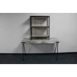A contemporary side table on metal legs,